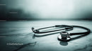 Modern Stethoscope on Marble Surface with Bokeh Background