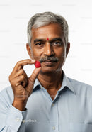 Smiling Middle-Aged Man Holding Raspberry for Healthy Lifestyle