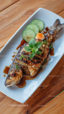 Grilled Fish with Cucumber and Herb Garnish on Plate
