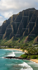 Scenic Tropical Beach with Lush Green Mountains and Ocean Waves