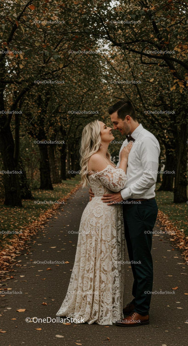 Romantic couple embracing on autumn tree-lined path