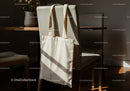 Canvas tote bag hanging on cozy dining chair