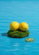 Fresh lemons on moss island surrounded by water