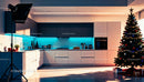 Modern kitchen with decorated Christmas tree and ambient lighting