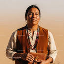 Portrait of Indigenous Woman Wearing Traditional Clothing in Desert Landscape