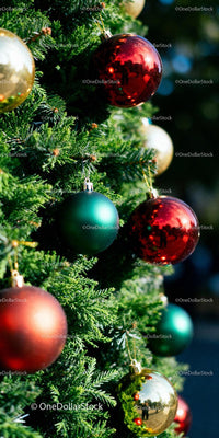 Festive Christmas tree decorated with colorful shiny baubles