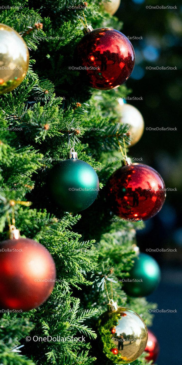 Festive Christmas tree decorated with colorful shiny baubles
