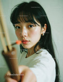 Close-up Portrait of a Young Woman with Black Hair Wearing Stylish Earrings