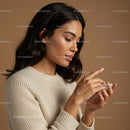 Young Woman Applying Lotion for Healthy Glowing Skin