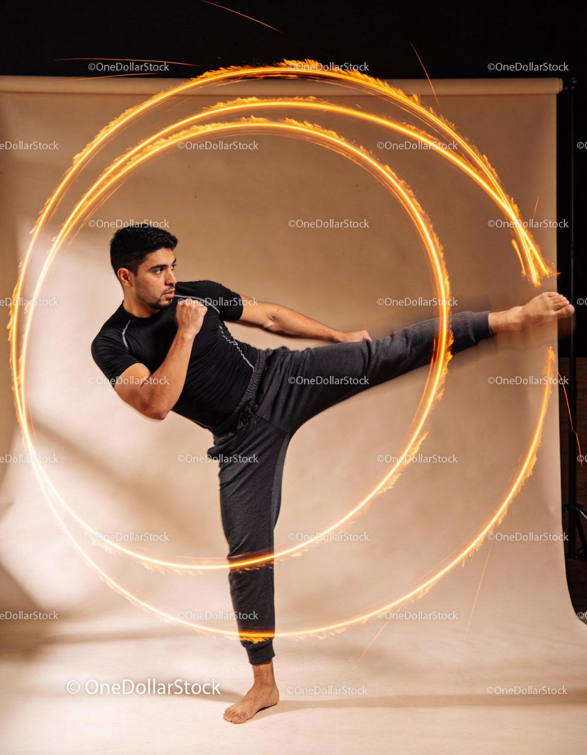 Man Delivering High Kick with Fiery Motion Effect