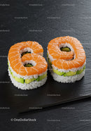 Fresh salmon sushi pieces shaped as number sixty nine