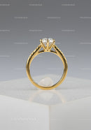 Gold Engagement Ring with Solitaire Diamond on Elegant Display