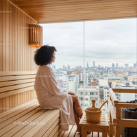 Woman Relaxing in Sauna with City Skyline View