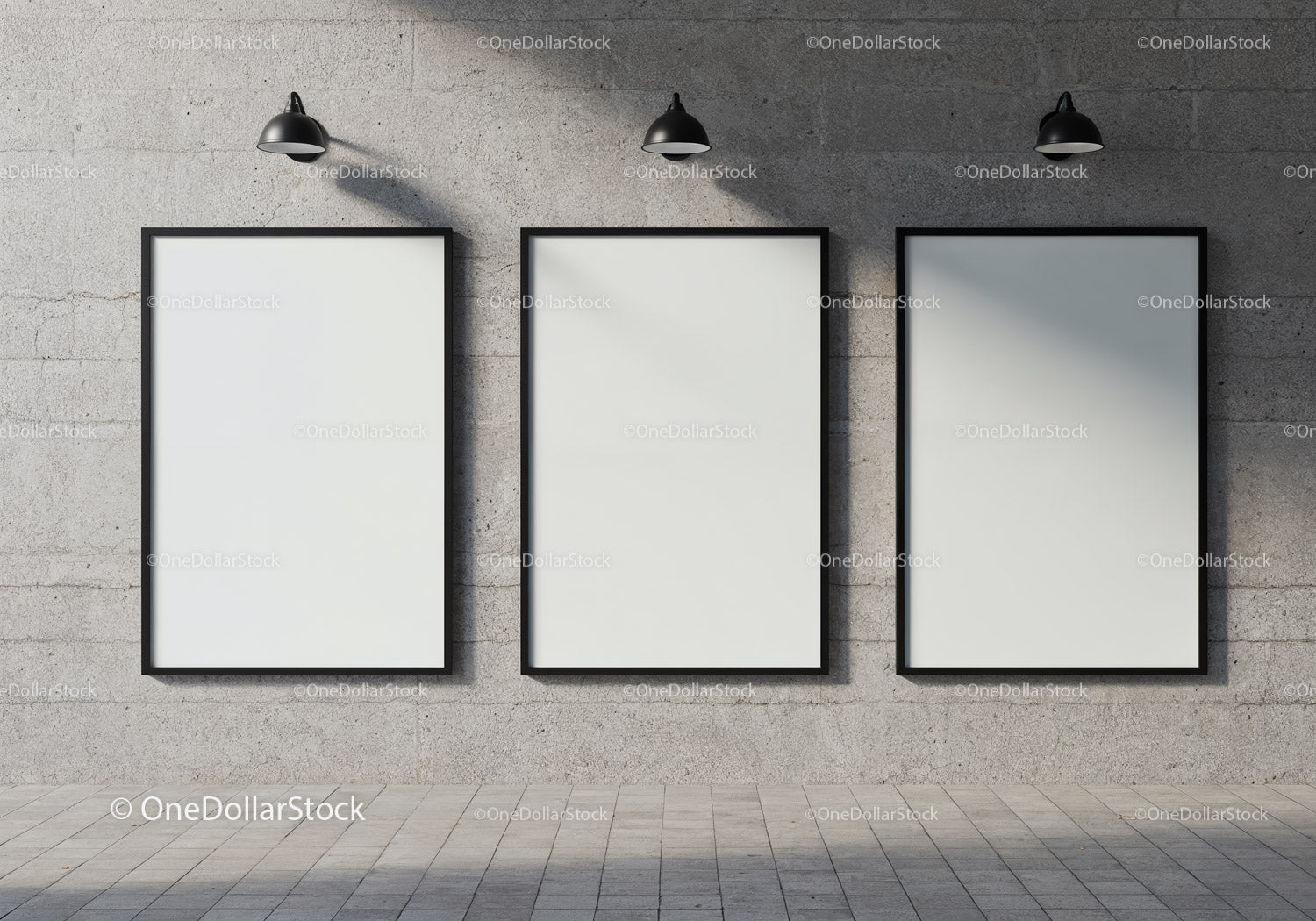 Minimalist blank frames on concrete wall with spotlights