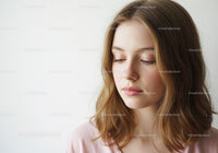 Young Woman with Brown Hair and Elegant Calm Expression