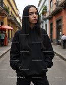 Fashionable Woman Wearing Black Hoodie in Urban City Street