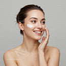 Elegant Woman Applying Facial Cream for Healthy Radiant Skin