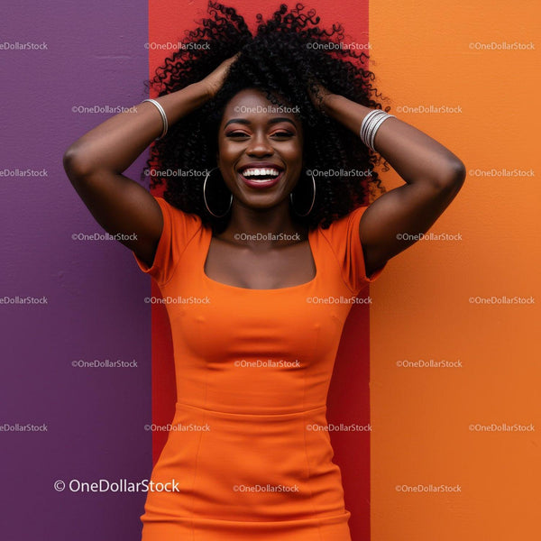 Joyful Woman with Curly Hair in Vibrant Orange Dress on Colorful Background