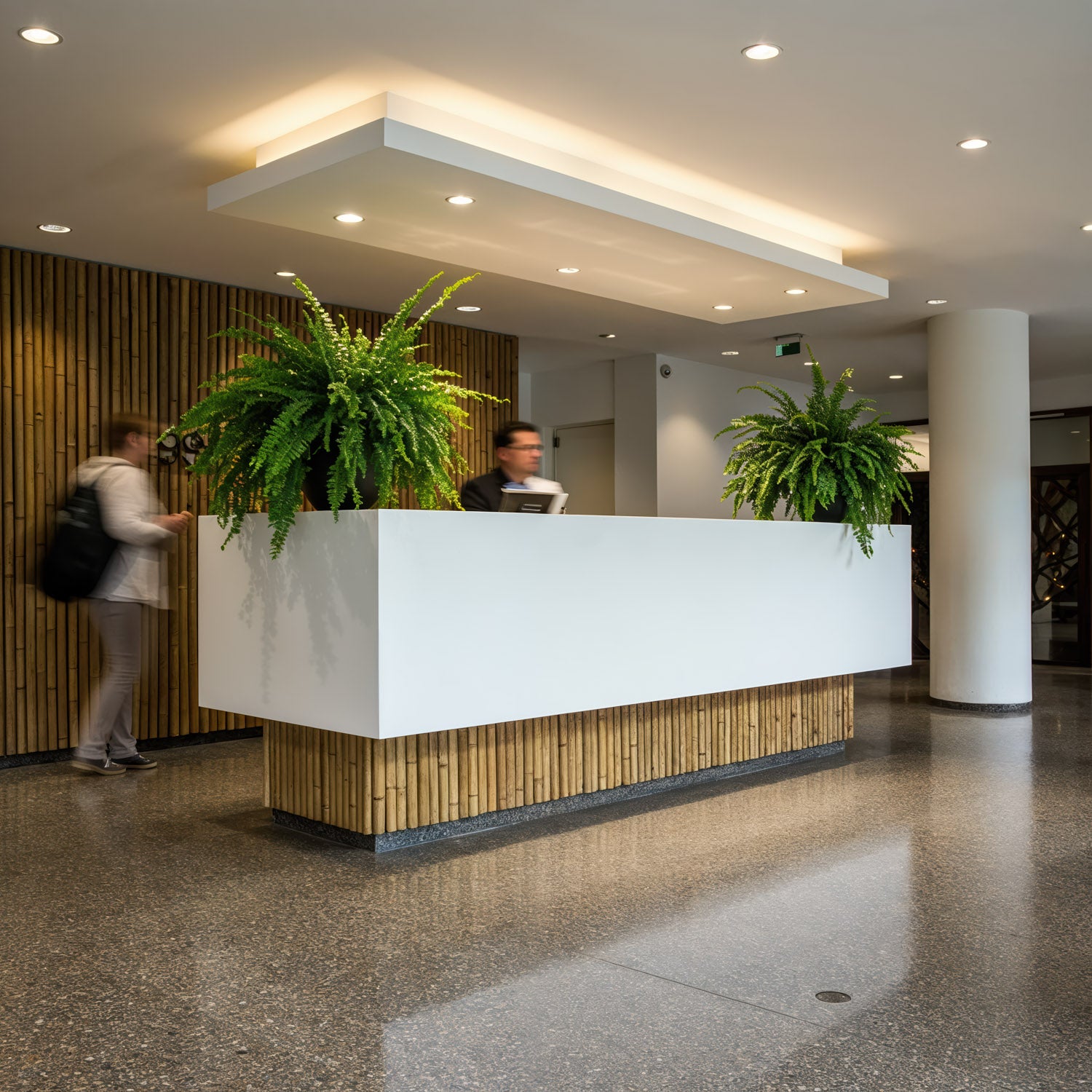 Modern hotel reception with lush green plants