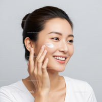 Young Woman Applying facial Moisturizer with Healthy Skin Glow