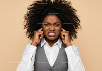 Frustrated Woman Covering Ears with Annoyed Expression Indoor Portrait