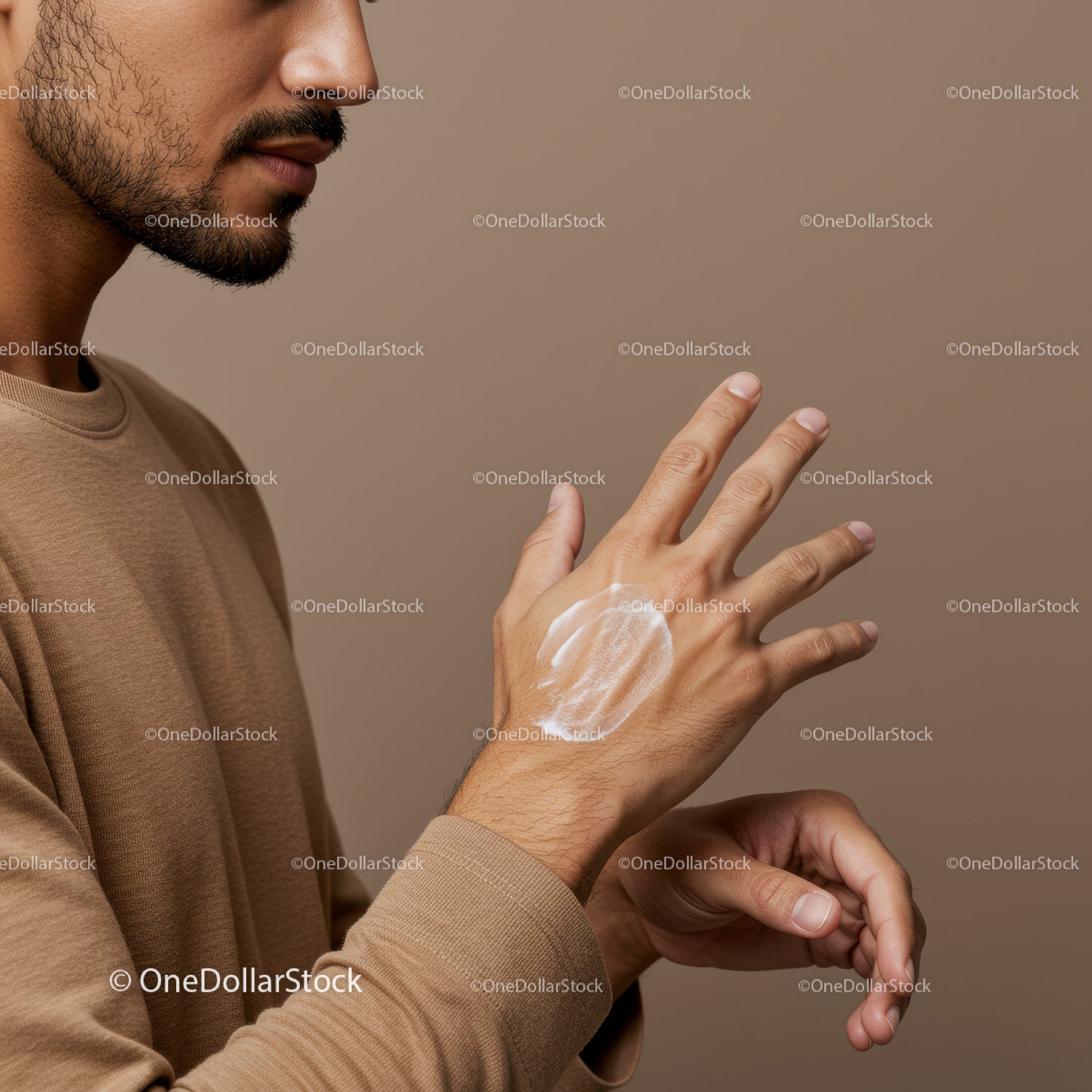 Close Up of Man Applying Lotion to Hand for Skincare Routine