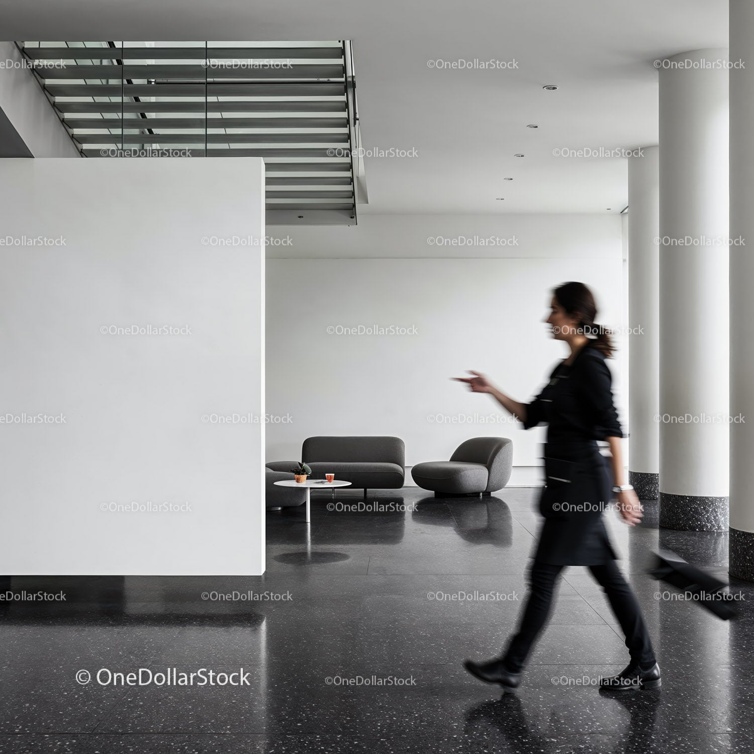 Woman Walking in Modern Minimalist Lobby Space