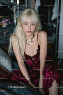 Elegant Woman in Velvet Dress with Jewelry in Indoor Portrait