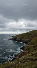 Dramatic Rocky Coastline Under Moody Overcast Sky