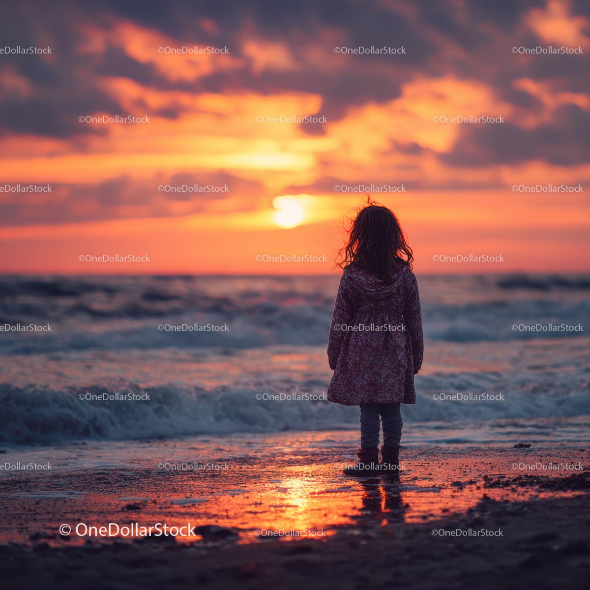 Silhouette of a Child at Sunset by the Ocean Shore