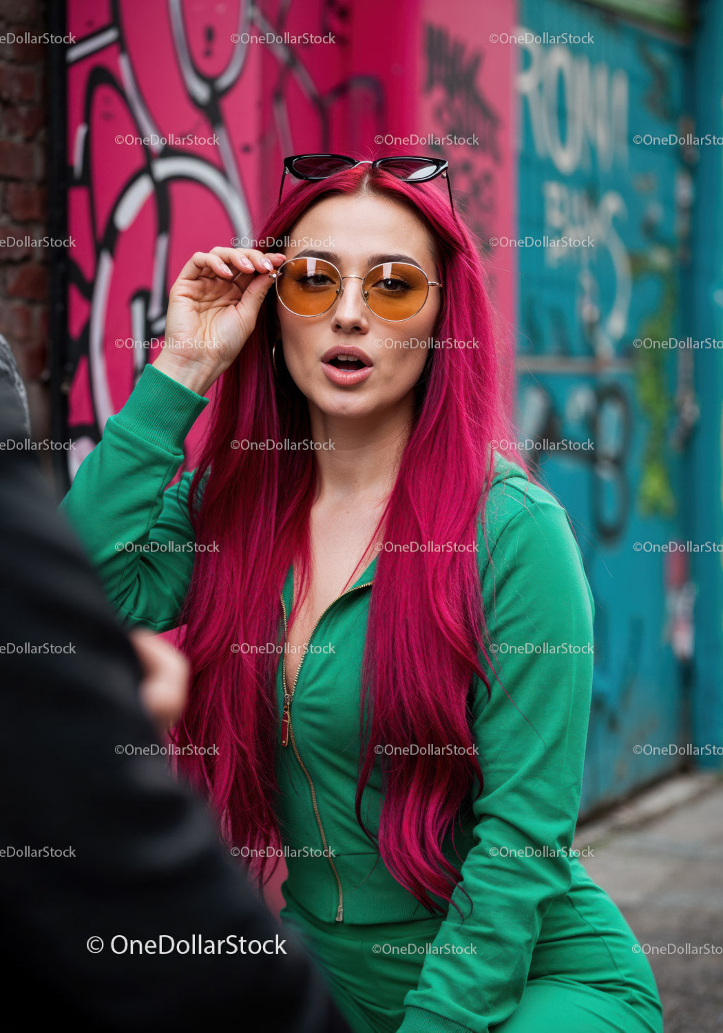 Vibrant Red Hair Woman in Green Tracksuit with Sunglasses in City