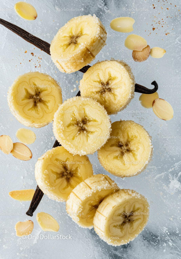 Close-up of sugared banana slices with almond flakes
