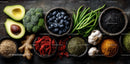 Fresh Organic Superfoods and Vegetables Array on Dark Background
