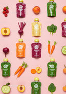 Colorful smoothie pouches with fresh fruits and vegetables