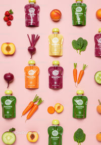 Colorful smoothie pouches with fresh fruits and vegetables