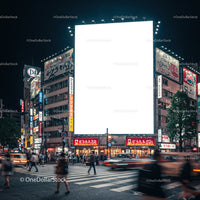 Busy urban intersection with illuminated billboards at night