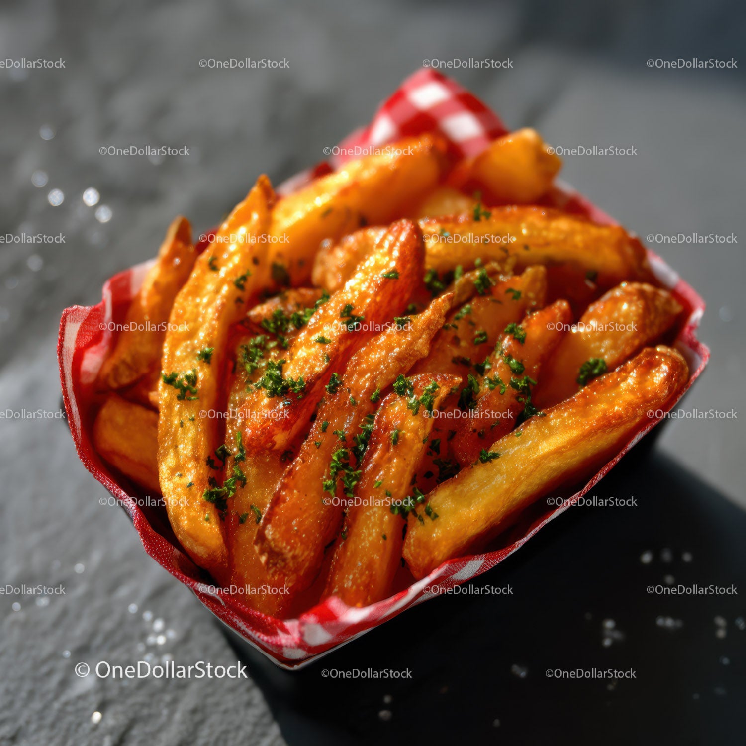 Crispy Golden French Fries Garnished with Herbs in a Red Basket