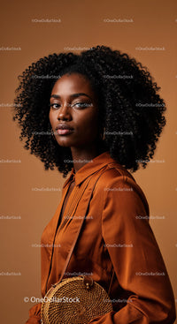 Stylish Young Black Woman with Curly Hair in Brown Satin Blouse
