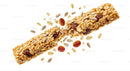 Crunchy granola bar breaking with seeds and dried fruit