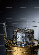 Close up of whiskey glass with melting ice cube