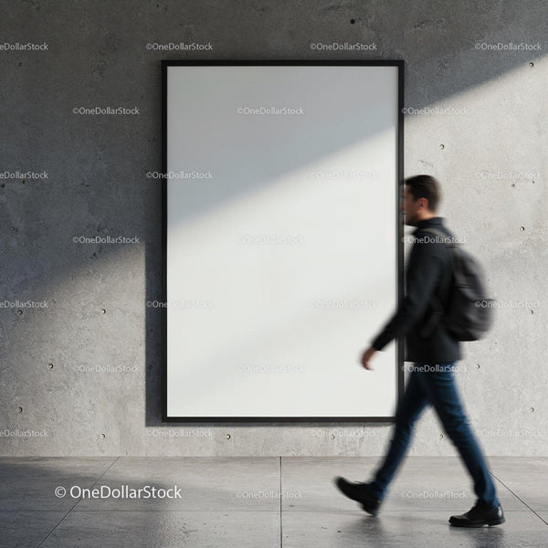 Man walking past blank poster on concrete wall JPG Mockup Image