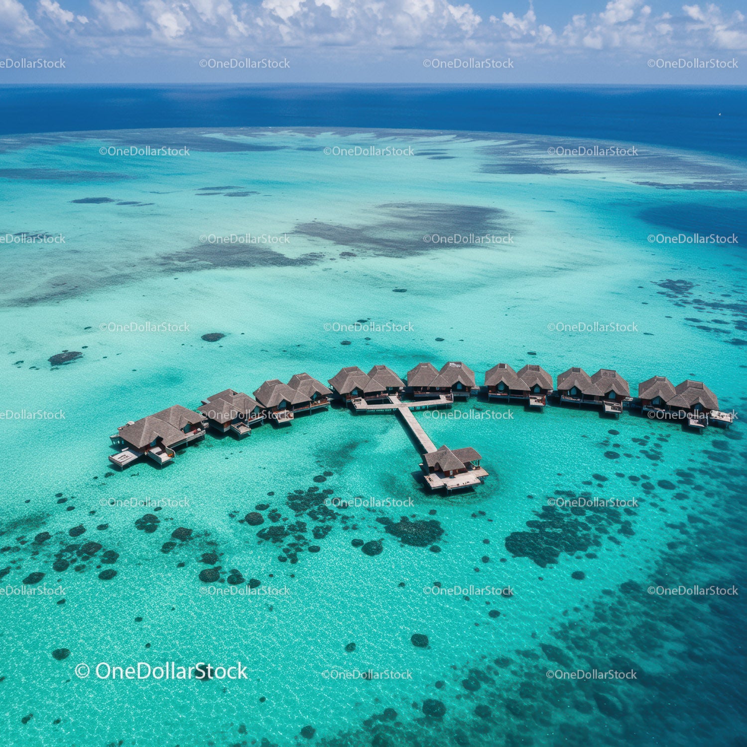 Overwater Bungalows in Turquoise Lagoon with Coral Reef View