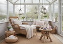 Cozy sunroom with natural textures and soft cushions