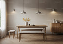Minimalist dining room with wooden furniture and soft lighting