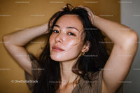 Healthy Skinned Woman with Wet Hair and Confident Expression