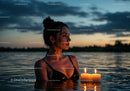 Woman in Black Bikini with Candles Floating in Lake at Sunset