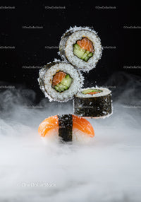Fresh salmon sushi and maki rolls with smoky background