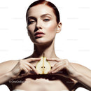 Elegant Woman with Fresh Pear in Bright Minimalist Studio
