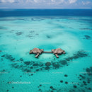 Overwater Bungalows in Turquoise Ocean with Scenic Tropical View