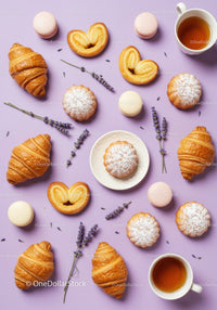 Assorted French pastries and tea on lavender background
